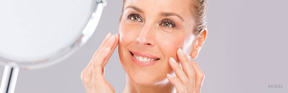 model smiling with spa product
